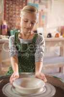 Happy girl making pot