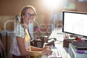 Woman working on computer in office