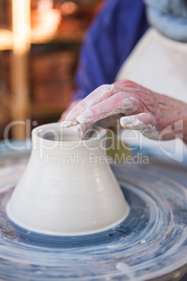 Close-up of potter making pot