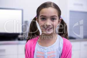 Smiling girl in dental clinic