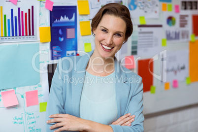 Portrait of businesswoman smiling with arms crossed