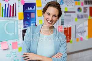 Portrait of businesswoman smiling with arms crossed