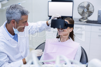 Female patient virtual reality headset during a dental visit