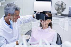 Female patient virtual reality headset during a dental visit