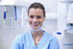 Smiling dental assistant in dental clinic