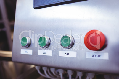 Stop button on machinery at brewery
