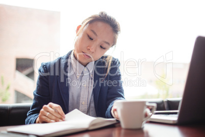 Young woman studying in college