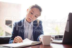 Young woman studying in college