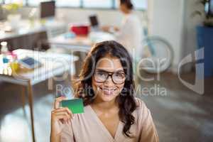 Businesswoman holding a credit card