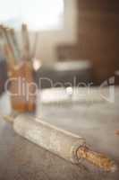 Close-up of rolling pin on table