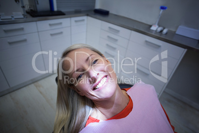 Female patient sitting on dentist chair