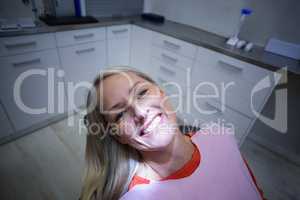 Female patient sitting on dentist chair