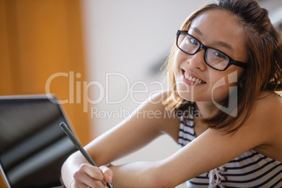 Young woman studying in classroom