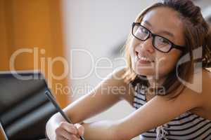 Young woman studying in classroom