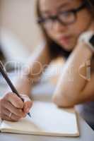 Young woman studying in classroom