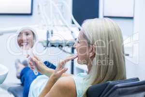 Female patient looking at mirror