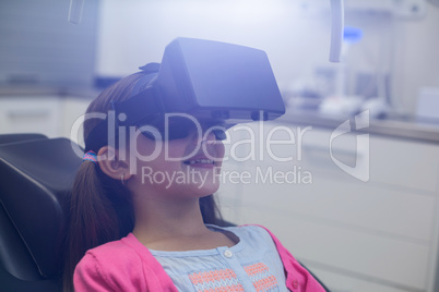 Girl using virtual reality headset during a dental visit