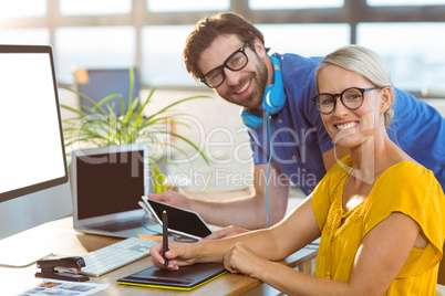 Graphic designers smiling in office