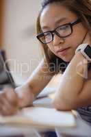 Young woman studying in classroom