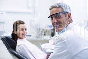 Portrait of dentist and female patient