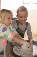 Smiling girls making pot