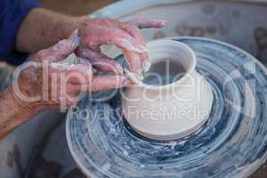 Close-up of potter making pot