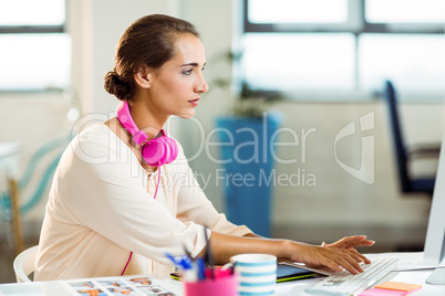 Female graphic designer working on computer