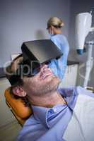 Smiling man using virtual reality