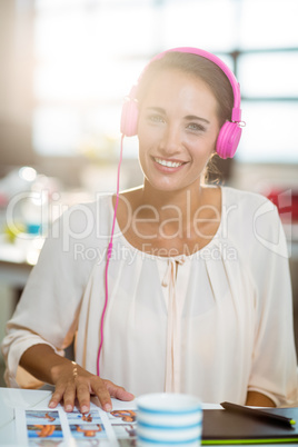 Graphic designer listening to music