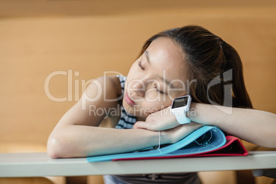 Young woman sleeping in classroom