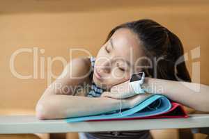 Young woman sleeping in classroom