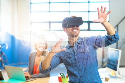 Male graphic designer using the virtual reality headset