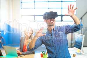 Male graphic designer using the virtual reality headset