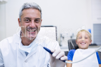 Dentist holding dental tool