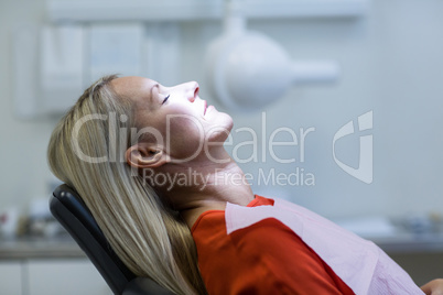 Woman relaxing on dentist chair