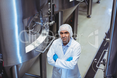 Portrait of manufacturer standing at brewery