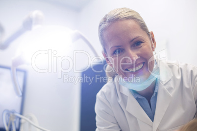 Smiling female dentist in dental clinic