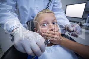 Young patient scared during a dental check-up