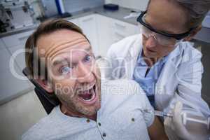 Male patient scared during a dental check-up