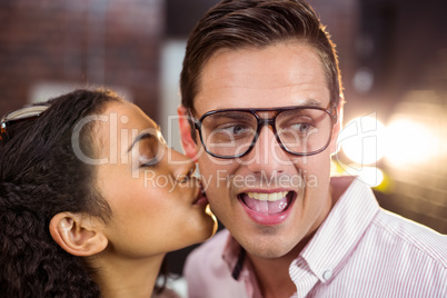 Woman kissing man on cheek