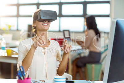 Female graphic designer using the virtual reality headset