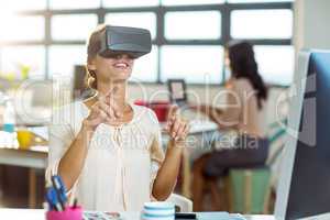 Female graphic designer using the virtual reality headset