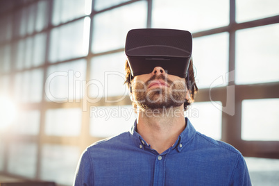 Male business executive using virtual reality headset