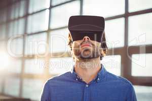 Male business executive using virtual reality headset