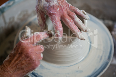 Close-up of potter making pot