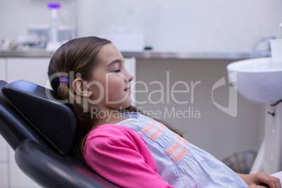 Young patient sitting on dentists chair