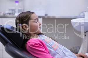 Young patient sitting on dentists chair