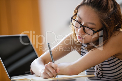 Young woman studying in classroom