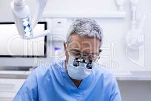 Dentist with surgical loupes