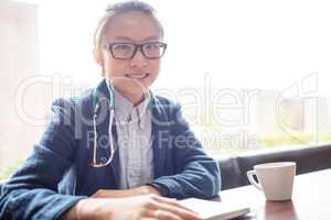 Female doctor sitting in clinic